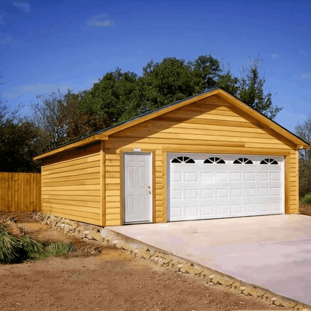 Wooden garage with white garage door and side entrance, set in a landscaped area, representing USA Garage Door Repair Naples' expertise in garage door solutions.