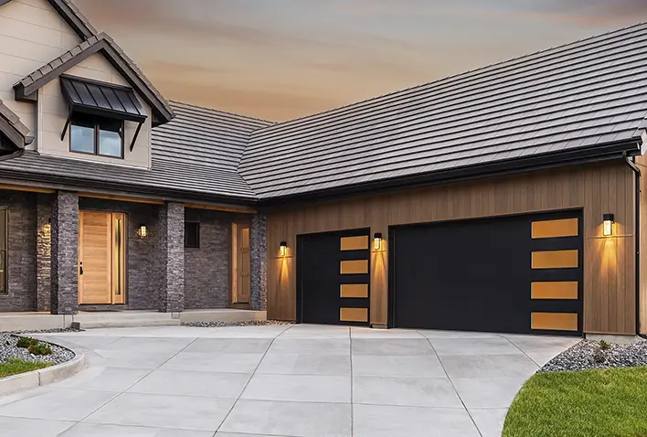 Modern garage doors with sleek design and ambient lighting, enhancing curb appeal of a residential property in Naples.
